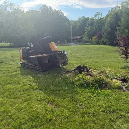 Stump grinder on an open, grassy Central Indiana property